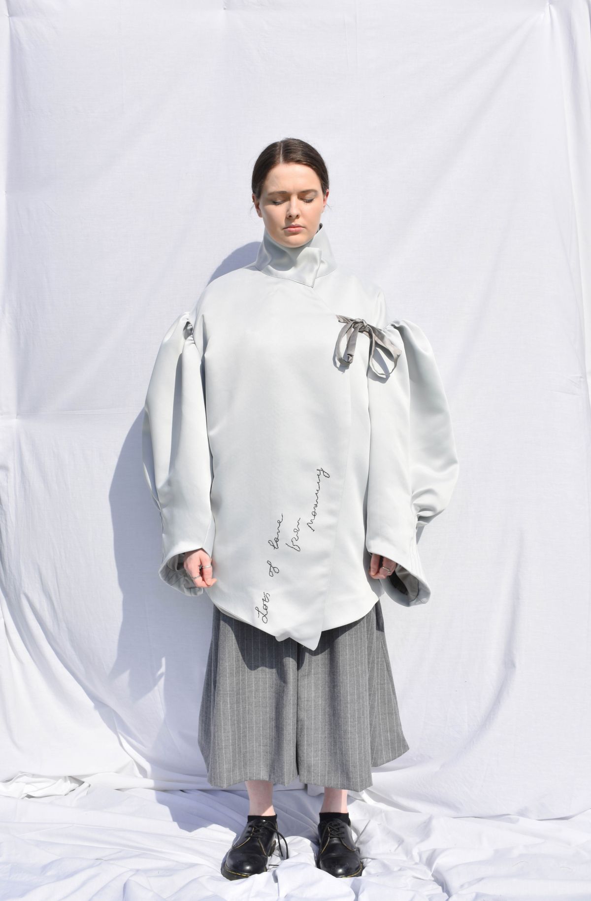 -Every Grace and Blessing You Need - Outfit 1; Outer layer, Heavy bonded satin with hand embroidery details, suiting wool trousers.