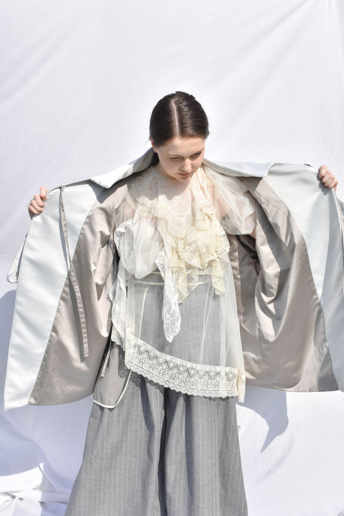 -Every Grace and Blessing You Need - Outfit 1; Outer layer, Heavy bonded satin with hand embroidery details, suiting wool trousers with large outer pocket detail, and vintage lace pieces with bridal tulle.