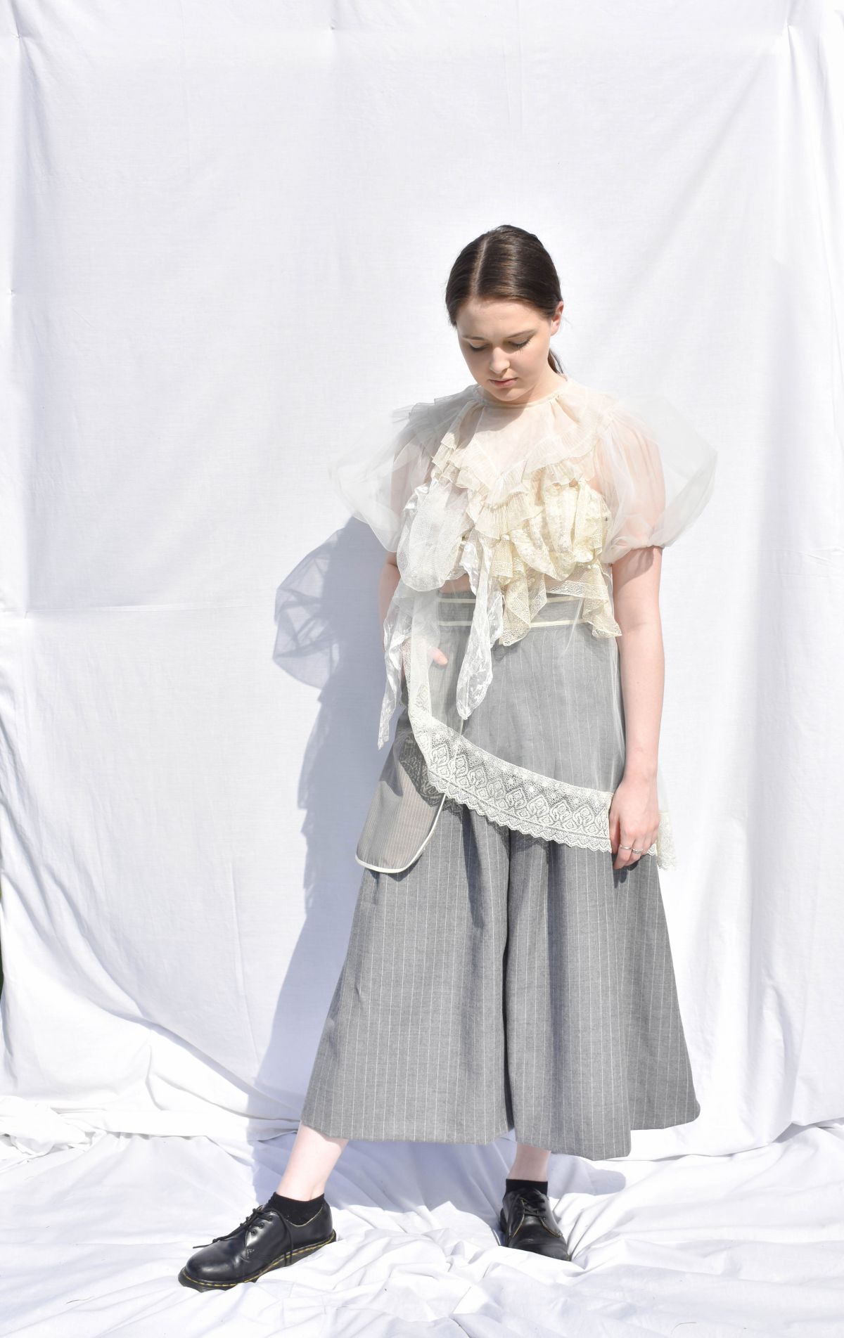 -Every Grace and Blessing You Need - Outfit 1; Underlayer, suiting wool trousers with large outer pocket detail, and vintage lace pieces with bridal tulle.